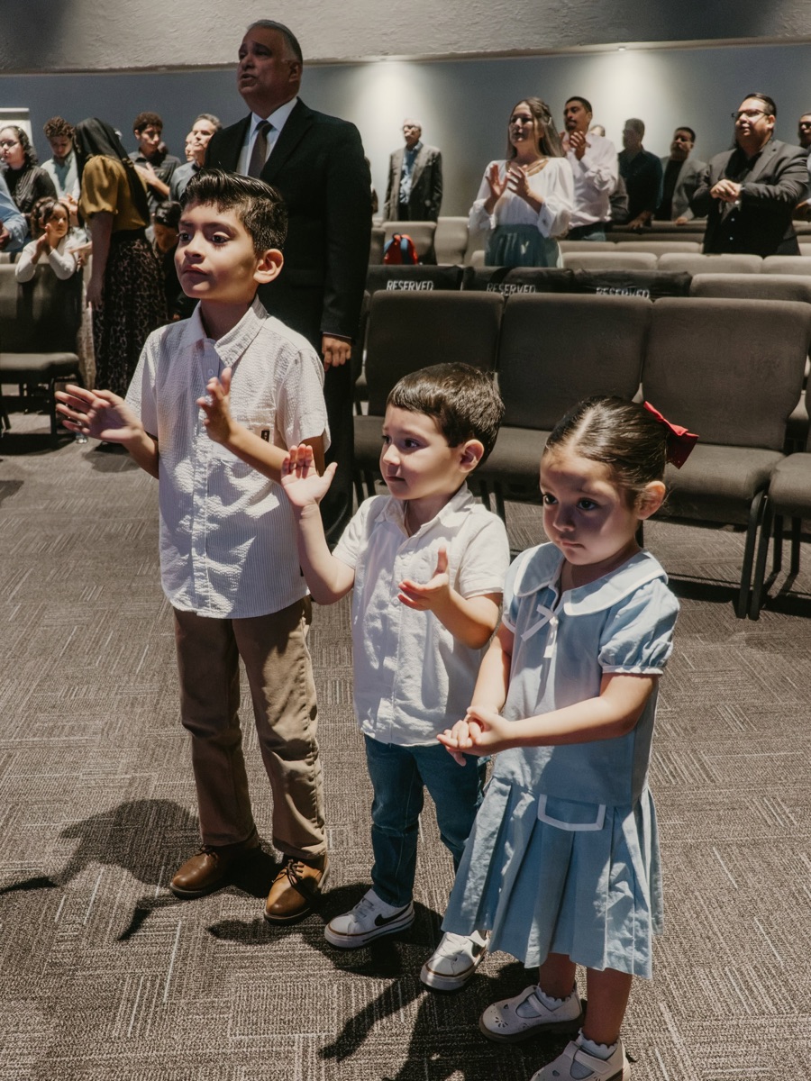 Children worshipping during service